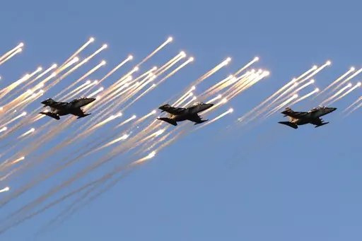Belarusian army Su-25 jet fighters fly during a parade marking Independence Day in Minsk, Belarus, Wednesday, July 3, 2019. Russian President Vladimir Putin has announced that he intends to deploy tactical nuclear weapons on the territory of Belarus. The move appears to be another attempt by Putin to raise the stakes in the conflict in Ukraine. (AP Photo/Sergei Grits, File)