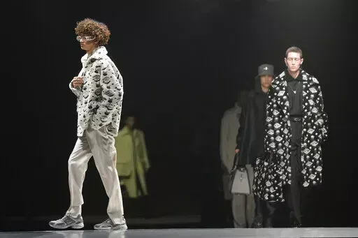 Models wear creations for the Fendi fall winter 22/23 collection, in Milan, Italy, Saturday, Jan. 15, 2022. (AP Photo/Antonio Calanni)