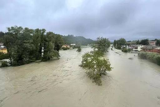 A view of an overflowing Savio river in Cesena, central Italy, Wednesday, May 17, 2023. The mayor of the city of Cesena, Enzo Lattuca, posted a video early Wednesday on Facebook to warn that continued heavy rains in the Emilia-Romagna region could again flood the Savio river and smaller tributaries. He urged residents to move to upper floors of their homes and avoid riverbanks, and announced the closure to traffic of some bridges and streets after heavy flooding sent rivers of mud sloshing throu