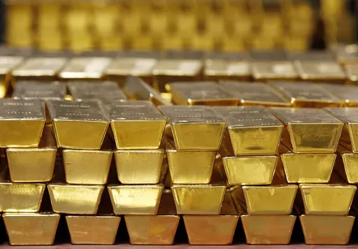 Gold bars are shown stacked in a vault at the United States Mint on July 22, 2014 in West Point, N.Y. (AP Photo/Mike Groll, File)