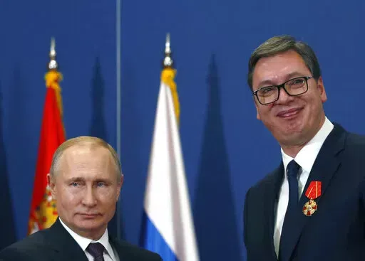 FILE- Russian President Vladimir Putin, left, poses with Serbian President Aleksandar Vucic after being awarded the Order of Alexander Nevsky in Belgrade, Serbia, Thursday, Jan. 17, 2019. Vucic said he has secured an "extremely favorable" gas deal with Russia during his telephone conversation with Vladimir Putin on Sunday, May 29, 2022. The Serbian populist president has announced that he has secured an “extremely favorable” gas deal with Russia. Serbian President Aleksandar Vucic, a former 