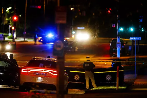 Memphis Police officers work an active shooter scene on Poplar Avenue in Memphis, Tenn. Wednesday, Sept. 7, 2022. Police in Memphis, Tennessee, said a man who drove around the city shooting at people during an hours-long rampage that forced frightened people to shelter in place Wednesday has been arrested. (Mark Weber/Daily Memphian via AP)