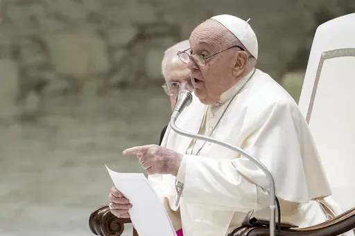 Pope Francis exchanges the season's greetings with Vatican employees, in the Paul VI Hall at the Vatican, Saturday, Dec. 21, 2024. (AP Photo/Andrew Medichini)