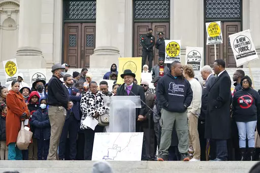 More than 200 people gather on the steps of the Mississippi Capitol on Jan. 31, 2023, to protest against a bill that would expand the patrol territory for the state-run Capitol Police within the majority-Black city of Jackson and create a new court system with appointed rather than elected judges. The expected move next week in Congress to overturn District of Columbia laws dealing with crime and voting reflects a larger political dynamic playing out across the country. (AP Photo/Rogelio V. Soli