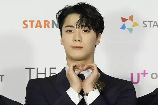 Moon Bin, a member of K-Pop group ASTRO, poses for photos on the red carpet for the 2021 Asia Artist Awards in Seoul, South Korea, Dec. 2, 2021. Moon Bin was found dead at his home in Seoul, his management agency said Thursday, April 20, 2023. (AP Photo/Lee Jin-man, File)