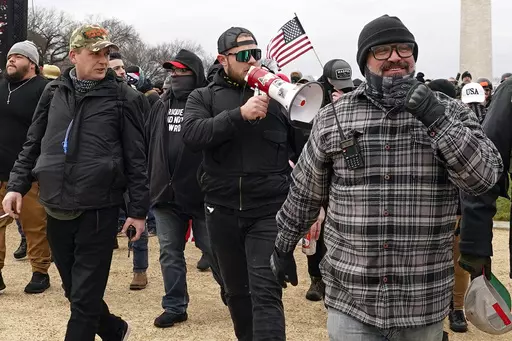 Proud Boys members including Zachary Rehl, left, Ethan Nordean, center, and Joseph Biggs, walk toward the U.S. Capitol in Washington, in support of President Donald Trump on Jan. 6, 2021. (AP Photo/Carolyn Kaster, fFle)