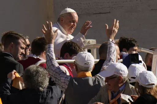 Pope Francis arrives for his weekly general audience in St. Peter's Square, at the Vatican, Wednesday, April 26, 2023. (AP Photo/Alessandra Tarantino)