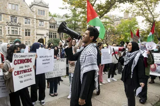 Pro-Palestinian demonstrators gather to protest University of Michigan President Santa Ono's "Statement regarding Mideast violence" outside the University of Michigan President's House, Oct. 13, 2023, in Ann Arbor, Mich. The University of Michigan failed to assess whether protests and other incidents on campus in response to the Israel-Hamas war created a hostile environment for students, staff and faculty. That's according to the results of an U.S. Education Department investigation announced M