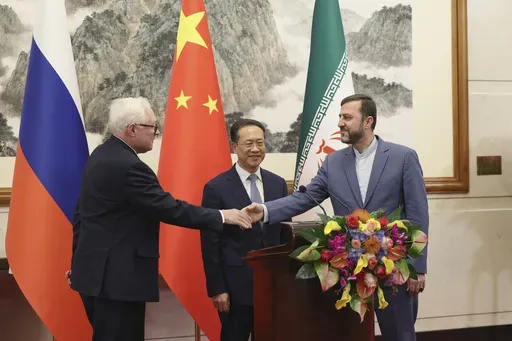 From left, Russian Deputy Foreign Minister Sergei Ryabkov, Chinese Vice Foreign Minister Ma Zhaoxu and Iranian Deputy Foreign Minister Kazem Gharibabadi, meet with reporters after their meeting at Diaoyutai State Guest House on March 14, 2025 in Beijing, China. (Lintao Zhang/Pool Photo via AP)