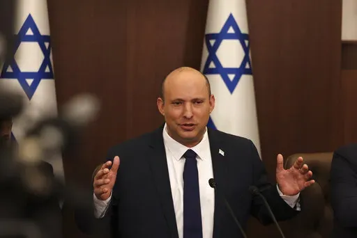 Israeli Prime Minister Naftali Bennett speaks during a weekly cabinet meeting in Jerusalem on Sunday, May 1, 2022. Bennett says he accepted an apology from Russian President Vladimir Putin for controversial remarks about the Holocaust made by Moscow’s top diplomat. But there was no mention of an apology in the Russian statement on Thursday, May 4,  call between the two leaders. (Menahem Kahana/Pool Photo via AP, File)