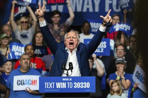 Democratic vice presidential nominee Minnesota Gov. Tim Walz speaks at a campaign rally, Saturday, Aug. 17, 2024, at The Astro in La Vista, Neb. (AP Photo/Bonnie Ryan)
