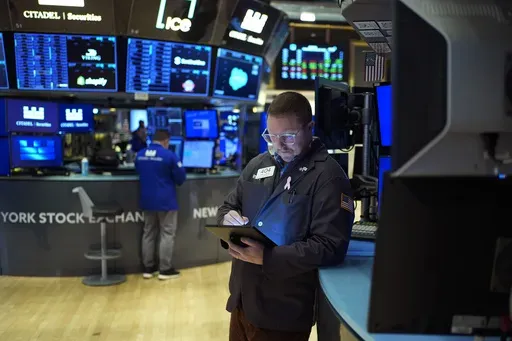 Traders work on the floor at the New York Stock Exchange in New York, Wednesday, Jan. 29, 2025. (AP Photo/Seth Wenig), File)