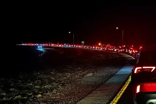 Traffic inches along southbound Interstate 93 near Franconia, N.H., on Monday, April 8, 2024, more than eight hours after the solar eclipse. Thousands of people had traveled to a group of rural communities in the state, which were in the path of totality (AP Photo/Nick Perry)