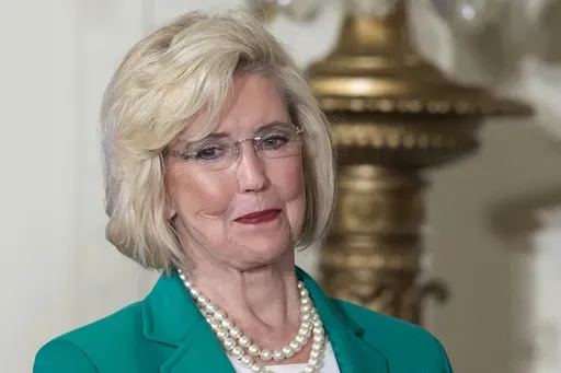 Lilly Ledbetter looks to the audience as President Barack Obama speaks in the East Room of the White House in Washington, April 8, 2014, during an event marking Equal Pay Day. (AP Photo/Carolyn Kaster, File)