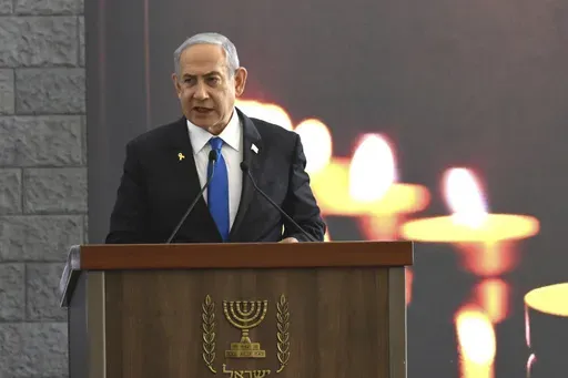 Israeli Prime Minister Benjamin Netanyahu speaks at a memorial ceremony for those killed by Hamas on Oct. 7, 2023, and those who fell in the "Iron Sword" war, at the Knesset, the Parliament, in Jerusalem, Monday, Oct. 28, 2024. (Debbie Hill, Pool Photo via AP)