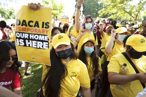 Susana Lujano, left, a dreamer from Mexico who lives in Houston, joins other activists to rally in support of the Deferred Action for Childhood Arrivals program, also known as DACA, at the U.S. Capitol in Washington on June 15, 2022. The fate of DACA, a program preventing the deportation of hundreds of thousands of immigrants brought into the United States as children, was set Friday, Oct. 14, 2022, to again be in front of a federal judge who has previously declared it illegal. (AP Photo/J. Scot