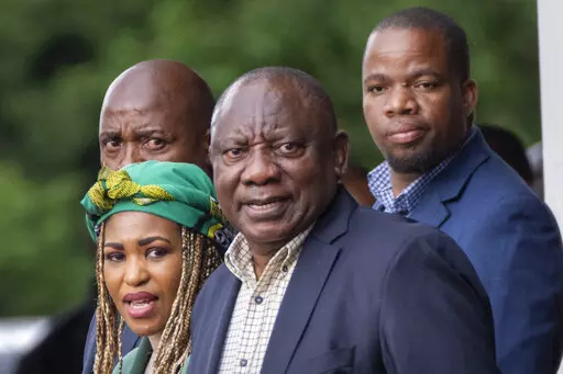South African President Cyril Ramaphosa leaves an African National Congress (ANC) national executive committee in Johannesburg, South Africa, Dec. 5, 2022. Ramaphosa is fighting for his political future in a dramatic reversal of fortunes for an anti-apartheid icon once admired for tackling the problems of Africa's most developed economy. (AP Photo/Jerome Delay, File)