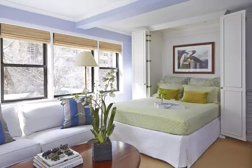 This image provided by Higgins Design Studio shows an open Murphy bed. (Mentis Photography/Higgins Design Studio via AP)