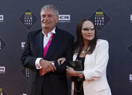 Leonard Whiting, left, and Olivia Hussey arrive at the screening of "The Producers" at the 2018 TCM Classic Film Festival Opening Night at the TCL Chinese Theatre on April 26, 2018, in Los Angeles. A Los Angeles County judge on Thursday, May 25, 2023, said she will dismiss a lawsuit that the stars, Whiting and Hussey, of 1968's “Romeo and Juliet" filed over the film's nude scene, which they said involved them being subjected to fraud, and sexual abuse and harassment when they were in their tee