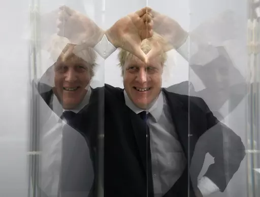 Boris Johnson, then Mayor of London looks through perspex as models of the next two commissions that will appear on the fourth plinth in Trafalgar Square are unveiled, in London, Friday, Jan. 14, 2011. He was the mayor who reveled in the glory of hosting the 2012 London Olympics, and the man who led the Conservatives to a whopping election victory on the back of his mission to “get Brexit done.” But Boris Johnson’s time as prime minister was marred by his handling of the coronavirus pandem