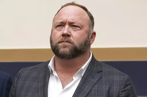 This Tuesday, Dec. 11, 2018, photo shows radio show host and conspiracy theorist Alex Jones at Capitol Hill in Washington. Jones was being questioned Wednesday, April 6, 2022, by lawyers for families of Sandy Hook Elementary School victims in Connecticut, where a judge had ordered the Infowars host to face mounting fines until he appeared for a deposition. (AP Photo/J. Scott Applewhite, File)