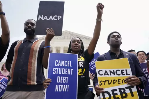 Jordan Braithwaite, 21, center, an undergrad at Grambling State University facing over $10,000 in student loans, demonstrates outside the Supreme Court, Friday, June 30, 2023, in Washington. A sharply divided Supreme Court has ruled that the Biden administration overstepped its authority in trying to cancel or reduce student loan debts for millions of Americans. Conservative justices were in the majority in Friday's 6-3 decision that effectively killed the $400 billion plan that President Joe Bi