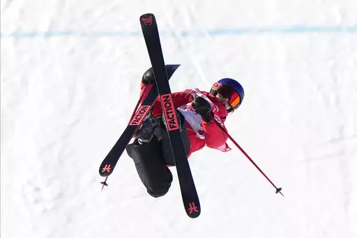 China's Eileen Gu competes during the women's slopestyle qualification at the 2022 Winter Olympics, Monday, Feb. 14, 2022, in Zhangjiakou, China. (AP Photo/Francisco Seco)