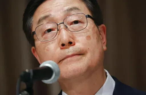 Tomihiro Tanaka, head of the Japan branch of South Korea’s Unification Church, listens to a reporter's question during a press conference in Tokyo, Monday, July 11, 2022. The Japan branch of South Korea’s Unification Church acknowledged Monday as its member the mother of the suspect in the assassination of former Prime Minister Shinzo Abe, but denied that it demanded large donations from anyone.(Yohei Fukai/Kyodo News via AP)