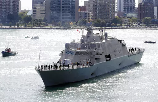The USS Detroit, a Freedom-class of littoral combat ship, arrives Friday, Oct. 14, 2016, in Detroit. The Navy that once wanted smaller, speedy warships to chase down pirates has made a speedy pivot to Russia and China and many of those ships, like the USS Detroit, could be retired. The Navy wants to decommission nine ships in the Freedom-class, warships that cost about $4.5 billion to build. (AP Photo/Carlos Osorio, File)