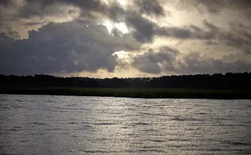 The sun rises over Sapelo Island, Ga., a Gullah-Geechee community, on June 10, 2013. (AP Photo/David Goldman, File)