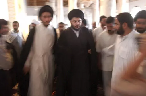 Muqtada al-Sadr is seen during prayers at the Al-Kufa Mosque Friday, July 18, 2003, in the holy city of Najaf, south of Baghdad, Iraq. Al-Sadr is a populist cleric, who emerged as a symbol of resistance against the U.S. occupation of Iraq after the 2003 invasion. (AP Photo/Wally Santana, File)