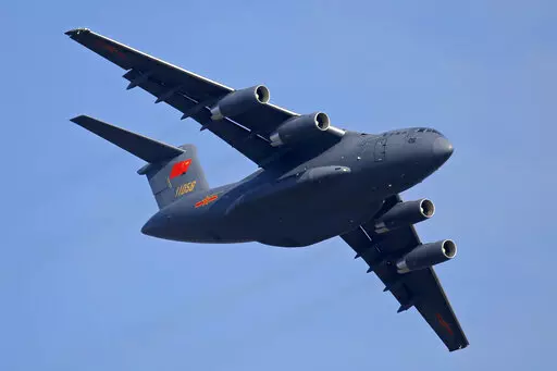 A Y-20 transport aircraft of the Chinese People's Liberation Army (PLA) Air Force performs during the 12th China International Aviation and Aerospace Exhibition, also known as Airshow China 2018, in Zhuhai city, southern China on Nov. 7, 2018. Media and military experts said Sunday, April 10, 2022, that six Chinese Air Force Y-20 transport planes landed at Belgrade's commercial airport early Saturday, reportedly carrying HQ-22 surface-to-air missile systems for the Serbian military.(AP Photo/Kin