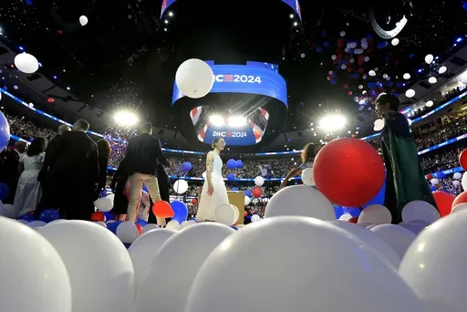 Balloons drop onto stage after Democratic presidential nominee Vice President Kamala Harris spoke on the final night of the Democratic National Convention in Chicago, Thursday, Aug. 22, 2024. (Kent Nishimura/The New York Times via AP, Pool)