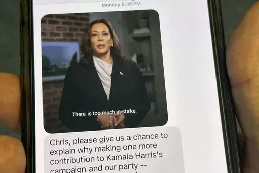A text is viewed on a mobile device Wednesday, Oct. 30, 2024, in Washington, as across the U.S., people's phones are pinging with text messages from Donald Trump, Kamala Harris and their allies in the presidential campaign's final days. (AP Photo/Jon Elswick)