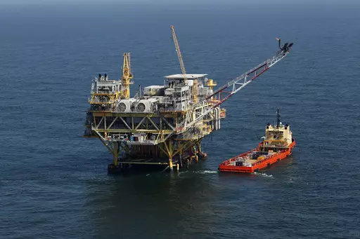 A rig and supply vessel are pictured in the Gulf of Mexico, off the cost of Louisiana, April 10, 2011. An auction of federal Gulf of Mexico leases for oil and gas drilling must be held in 37 days, a federal appeals court ruled Tuesday, Nov. 14, 2023, rejecting environmentalists arguments against the sale, and throwing out plans by the Biden administration to scale back the sale to protect an endangered species of whale. (AP Photo/Gerald Herbert, File)