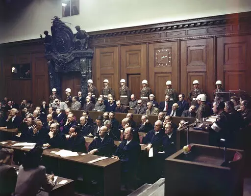 Defendants listen to part of the verdict in the Palace of Justice during the Nuremberg War Crimes Trial in Nuremberg, Germany on Sept. 30, 1946. Seated in the first row in the prisoner's dock are, from left: Hermann Goering, wearing dark glasses; Rudolf Hess; Joachim von Ribbentrop; Wilhelm Keitel; Ernest Kaltenbrunner; Alfred Rosenberg; Erich Raeder, wearing dark glasses; Wilhelm Frick; Julius Streicher;and Walter Funk. In the back row in front of the police guards are, from left: Karl Doenitz;