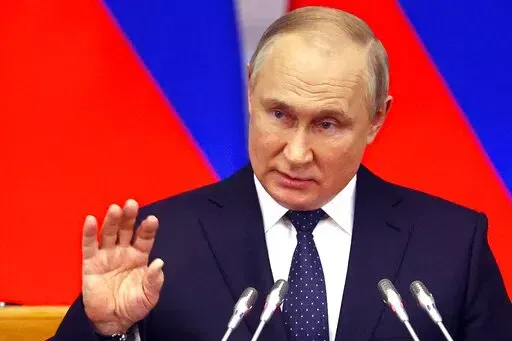 Russian President Vladimir Putin gestures while addresses a meeting of the Council of Legislators under the Russian Federal Assembly at the Tauride Palace, in St. Petersburg, Russia, Wednesday, April 27, 2022. (Alexander Demyanchuk, Sputnik, Kremlin Pool Photo via AP)
