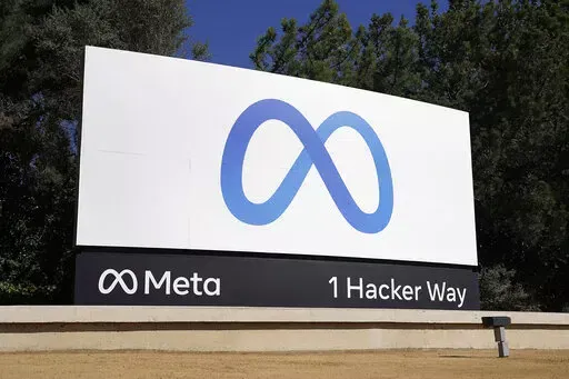 Facebook's Meta logo sign is seen at the company headquarters in Menlo Park, Calif. on Oct. 28, 2021. According to a report released Thursday, June 9, 2022, Facebook and parent company Meta once again failed to detect blatant, violent hate speech in advertisements submitted to the platform by the nonprofit groups Global Witness and Foxglove. (AP Photo/Tony Avelar, File)