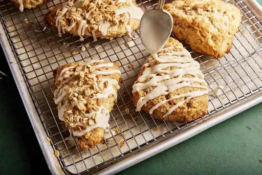 This image released by Milk Street shows a recipe for maple scones with toasted rolled oats. (Milk Street via AP)