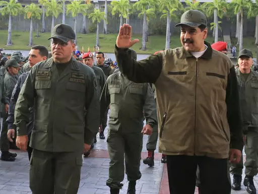 In this May 2, 2019 photo released by the Miraflores Press Office, Venezuela's President Nicolas Maduro, right, accompanied by his Defense Minister Vladimir Padrino, waves upon his arrival to Fort Tiuna, in Caracas, Venezuela. Venezuelan military officials said Saturday, Dec. 30, 2023, that they will continue to deploy nearly 6,000 troops until a British military vessel sent to neighboring Guyana leaves the waters off the coast of the two South American nations. (Jhonn Zerpa/Miraflores Press Off