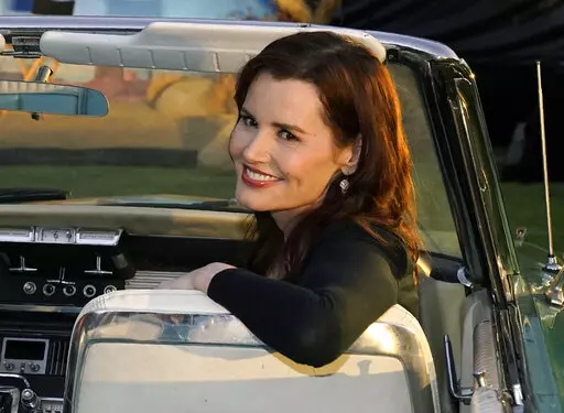 Geena Davis, star of "Thelma & Louise," poses in a 1966 Ford Thunderbird similar to the one featured in the film, at the 30th anniversary screening of the film in Los Angeles on June 18, 2021. Davis has a memoir coming out this fall, titled “Dying of Politeness.” HarperOne, an imprint of HarperCollins Publishers, announced Tuesday that the book will be published Oct. 11.  (AP Photo/Chris Pizzello, File)