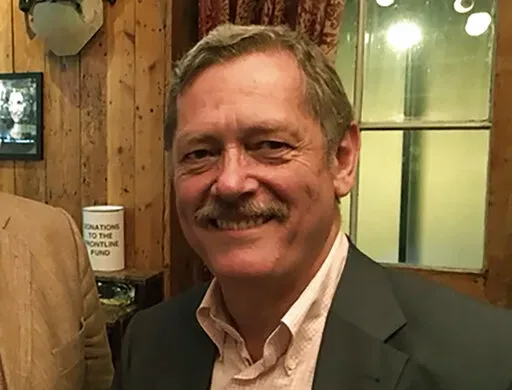 This photo provided by David Loyn shows Peter Jouvenal at the Frontline Club in London in 2017.  The U.S. and British governments, as well as a family member, say Afghanistan's Taliban rulers have detained several British citizens and an American. A statement from the British government this week said there are a number of British nationals currently in Taliban custody. While the government refused to release their identities, Hassina Syed, the wife of Peter Jouvenal, a former freelance camerama