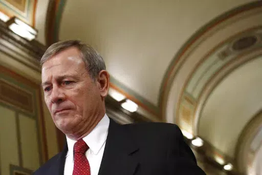 Chief Justice of the United States John Roberts departs at the end of the day in the impeachment trial of President Donald Trump on charges of abuse of power and obstruction of Congress on Capitol Hill in Washington, Wednesday, Jan. 29, 2020. Roberts is heading a Supreme Court in crisis. The chief justice has already ordered an investigation into the unprecedented leak earlier this week of a draft of a major abortion opinion. What comes next could further test Roberts’ leadership of a court. (