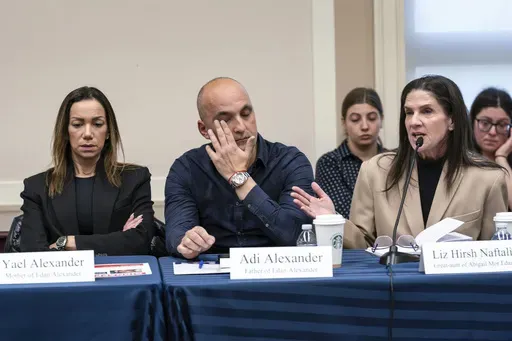 From left, Yael and Adi Alexander, parents of Eden Alexander, who was abducted and brought to Gaza on Oct. 7, 2023, listen to Liz Hirsh Naftali, great aunt of Abigail More Edan, as families and victims of the Hamas attacks meet with the House Foreign Affairs Committee, at the Capitol in Washington, Nov. 29. (AP Photo/J. Scott Applewhite, File)
