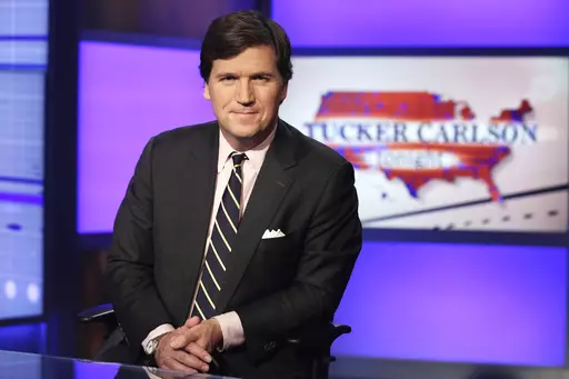 Tucker Carlson, host of "Tucker Carlson Tonight," poses for photos in a Fox News Channel studio on March 2, 2017, in New York. Russian President Vladimir Putin has been interviewed by former Fox News host Tucker Carlson, the Kremlin confirmed Wednesday. It is Putin's first interview to a Western journalist since the beginning of his full-scale invasion of Ukraine two years ago. (AP Photo/Richard Drew, File)