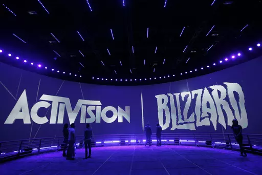 The Activision Blizzard Booth during the Electronic Entertainment Expo in Los Angeles, June 13, 2013. British regulators have blocked Microsoft's $69 billion deal to buy videogame maker Activision Blizzard over worries that it would stifle competition in the cloud gaming market.. (AP Photo/Jae C. Hong, File)