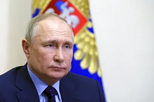 Russian President Vladimir Putin chairs a Security Council meeting via videoconference at the Novo-Ogaryovo residence outside Moscow, Russia, Thursday, April 7, 2022. (Mikhail Klimentyev, Sputnik, Kremlin Pool Photo via AP)