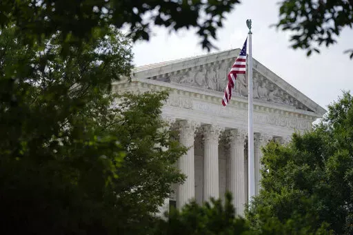An American flag waves in front of the U.S. Supreme Court building, Monday, June 27, 2022, in Washington. (AP Photo/Patrick Semansky, File)