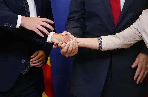 European Commission President Ursula von der Leyen, right, shakes hands with Albanian Prime Minister Edi Rama, North Macedonia's Prime Minister Dimitar Kovacevski and Czech Republic's Prime Minister Petr Fiala prior to a meeting at EU headquarters in Brussels, Tuesday, July 19, 2022. Leaders from more than 40 countries will gather Thursday, Oct. 6, 2022, in Prague, to launch a "European Political Community" aimed at boosting security and economic prosperity across the continent, but critics clai