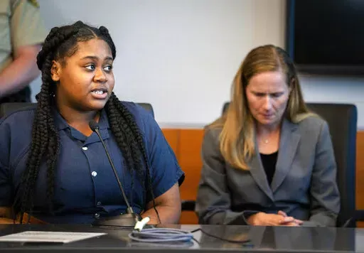 Pieper Lewis, left, speaks with Polk County District Judge David M. Porter during her sentencing hearing, Tuesday, Sept. 13, 2022. Donations are pouring in to help Lewis, a 17-year-old sex trafficking victim who was ordered by the court to pay $150,000 to the family of a man she stabbed to death after he raped her. A GoFundMe campaign set up for Pieper Lewis has already raised more than $200,000 just one day after the restitution order was handed down by an Iowa judge. (Zach Boyden-Holmes/The De